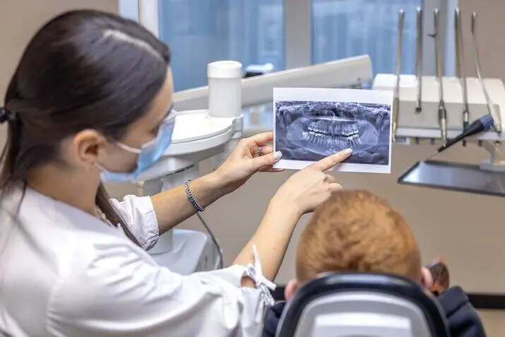 Dentist checking a dental X-ray